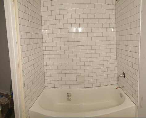 new tub, 2 x 4 inch white subway tile